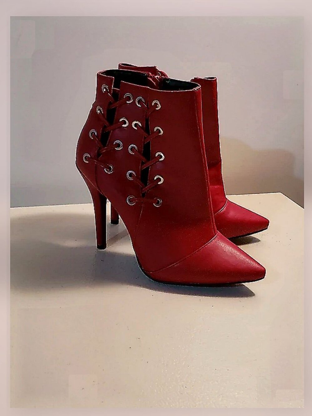 Cleopatra red leather heels with punch detail
